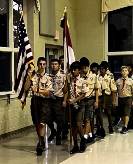 Photo of scouts processing into Schieck Hall for their court of honor